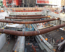 Load image into Gallery viewer, Layher Allround Scaffolding walkways, construction access stairs and scaffolds built by North Shore Scaffolding underneath Lower Queen Street, between Central Post Office (Britomart Station) and H&M, as part of the City Rail Link (CRL).