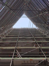 Load image into Gallery viewer, The International Apartments, looking up the scaffolding