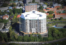 Load image into Gallery viewer, North Shore Scaffolding can supply the necessary structure so that you can use a Shrink Wrap product to protect your project. Shrink Wrap can be used in small and unique situations where the entire structure does not need to be covered, like in this project at Phoenix Gardens in Auckland.