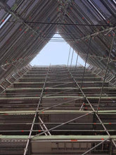 Load image into Gallery viewer, The International Apartments, looking up the scaffolding
